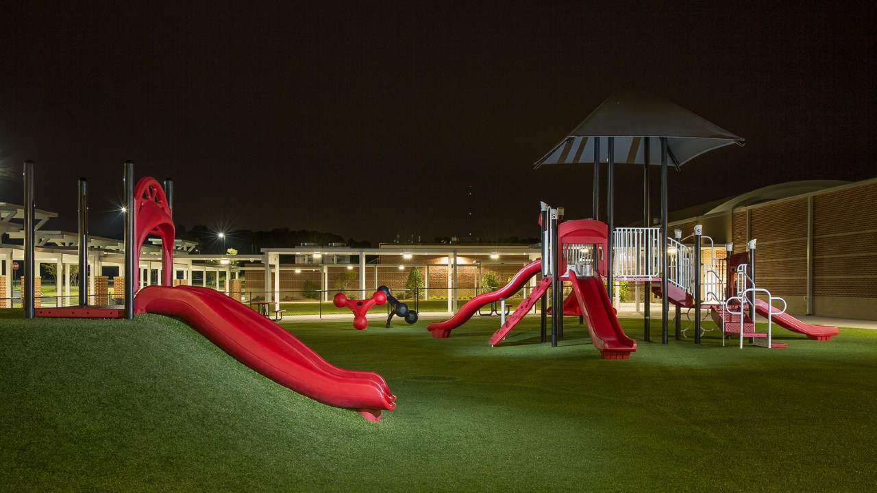 Nighttime artificial turf playground by Southwest Greens of Western Canada